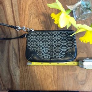 Black Coach wristlet with leather trim and strap